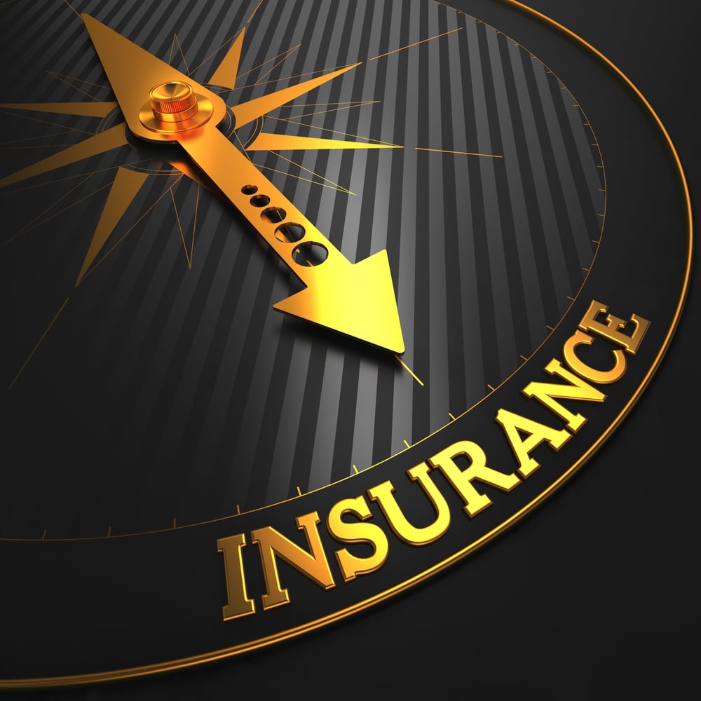 Insurance - Business Background. Golden Compass Needle on a Black Field Pointing to the Insurance Word.